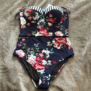 One-piece Cupshe bathing suit. Floral and stripe.